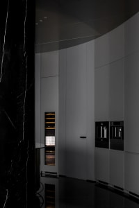 Modern kitchen with marble countertops and cabinets