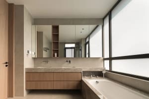 Modern bathroom with granite countertop and large window