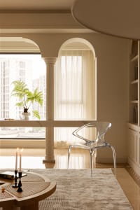 Modern residential interior design featuring glass, marble, and wooden elements.