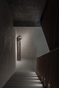 Minimalist interior design featuring a concrete staircase.