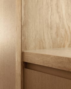 A modern office space featuring wooden materials.