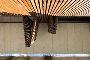 Modern building exterior with wooden slats and concrete walls