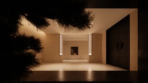 Modern minimalist interior space with concrete walls and floor, minimalist furniture, and a central fireplace.