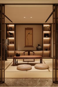A modern small room interior with minimalist design, featuring wooden furniture and lighting on the wall.