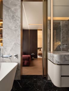 Modern residential interior featuring marble materials and contemporary design elements.