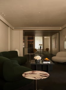 Modern minimalist living room featuring contemporary furniture in marble and concrete finishes.