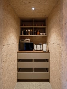 A modern kitchen with wooden cabinets, cupboards, and drawers.