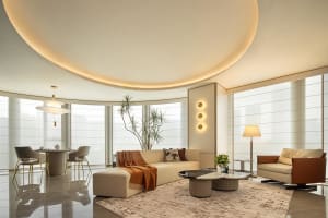 Luminous living room adorned with minimalist furnishings, featuring terrazzo flooring, sleek furniture, and contemporary ligh