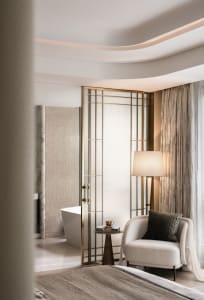 Modern residential bedroom suite with a contemporary design featuring a luxurious armchair, a floor lamp, and a glass-paned b