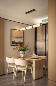 Modern dining room with marble table, wood chairs, and fabric seating.
