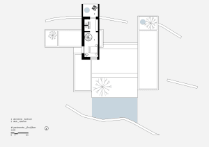 A modern floor plan on paper showing a bedroom and a solarium on the first floor.