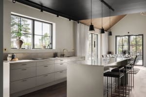 A modern residential kitchen featuring white cabinets and countertops, a large island, and a large window.