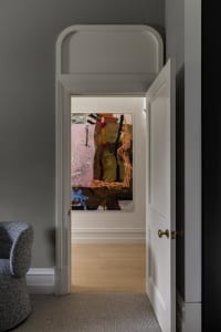 A modern entryway featuring a contemporary painting.