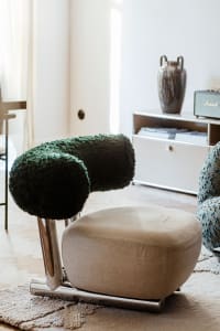 A cozy living room with plush fabric furniture and modern design elements.