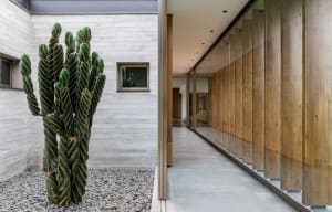 Modern interior design featuring concrete and glass materials.