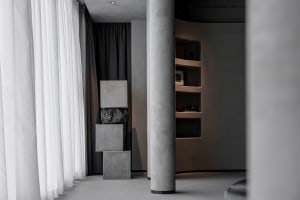 A minimalist space featuring concrete elements.