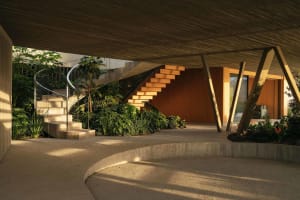 Interior shot of a modern indoor staircase with wooden steps and railings.