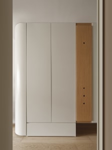 Modern minimalist wardrobe cabinet with white oak and white matte finish.