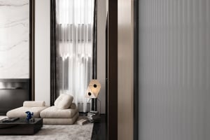 A minimalist living room featuring a modern sofa, floor lamp, and ethnic vase, with a focus on sleek lines and natural light.