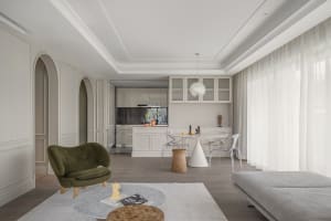 A modern apartment featuring a living room, kitchen, and dining area with minimalist design.