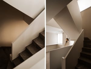 Modern interior design featuring a minimalist staircase with marble steps.
