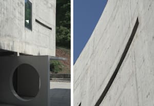 Modern architecture featuring concrete walls and circular openings.