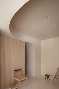 Minimalist modern interior design with wooden walls and chairs