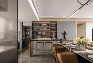 A modern residential kitchen featuring metallic, marble, and leather materials.