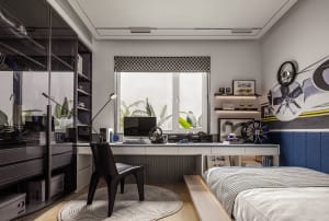 A modern industrial-style bedroom with a metal headboard, wooden floor, and minimalist decor.
