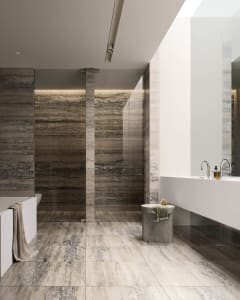 Modern bathroom with marble flooring and walls, featuring a large soaking tub and minimalist design.