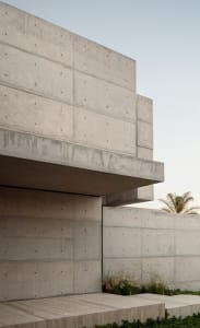 Modern building exterior featuring concrete walls and a minimalist design.