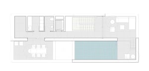 Modern interior design featuring a concrete floor, glass windows, and metallic accents.
