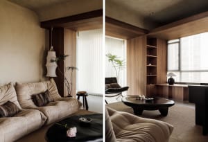 A modern living room featuring wooden walls and furniture.