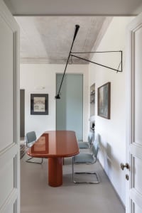 Minimalist dining room with modern furniture and sleek, contemporary design.
