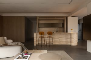 Modern residential kitchen featuring a stone counter with minimalist design.