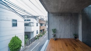 Modern interior space featuring concrete and wooden elements.