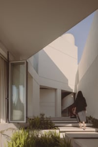 A minimalist modern interior with concrete and glass.