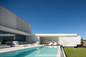 Modern residential building featuring metal board and glass exterior