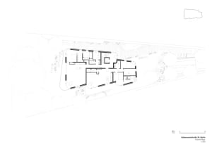 A modern residential floor plan featuring a combination of white and black lines and shapes, with a focus on open space and n
