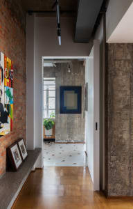 An industrial design interior featuring concrete walls and floor tiles in a minimalist setting.