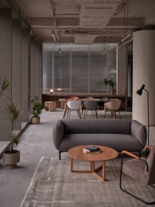 Modern, industrial-style office space featuring concrete finishes.