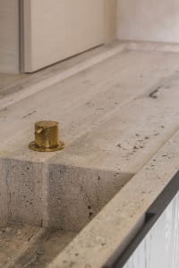 Close-up of a minimalist concrete bathroom countertop