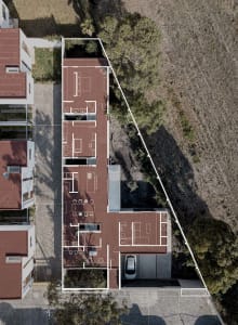 Aerial view of a modern house layout with a brick tiled exterior.