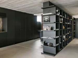 Modern interior design featuring bold metal shelving units.