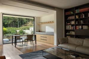 Modern living room with wooden floors and integrated kitchen area