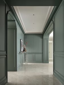Modern corridor interior with green walls and marble floor