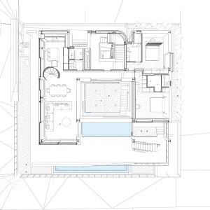 Floor plan of a modern residential home featuring concrete and glass materials.
