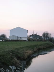 A modern building constructed primarily of concrete materials.