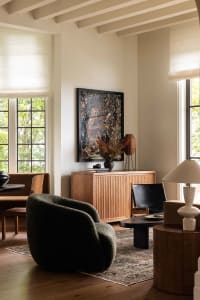 Modern living room featuring wooden framed furniture and upholstered with wool.