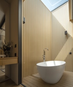 Modern bathroom featuring wooden walls and a white tub